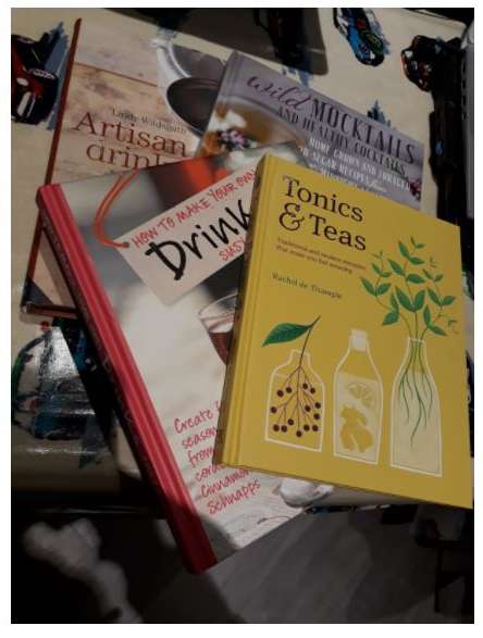 picture of three books - yellow tonics & teas Rachel de Temple, How to make your drinks Susy Atkins, Wild mocktails and healthy cocktails, artisan drinksby 